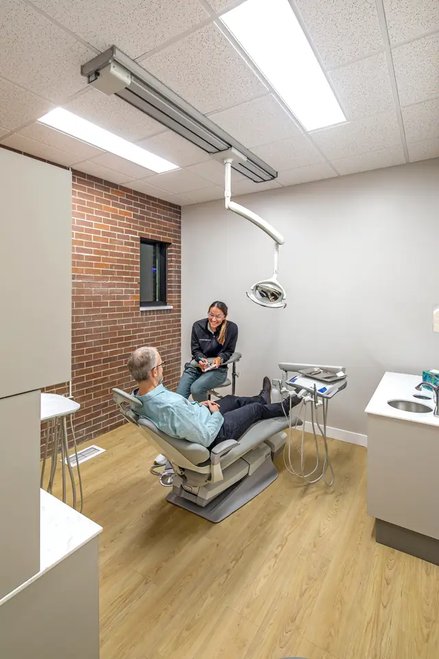 Dr. Sarah Billesbach with a patient in the exam room at Mancuso Dental
