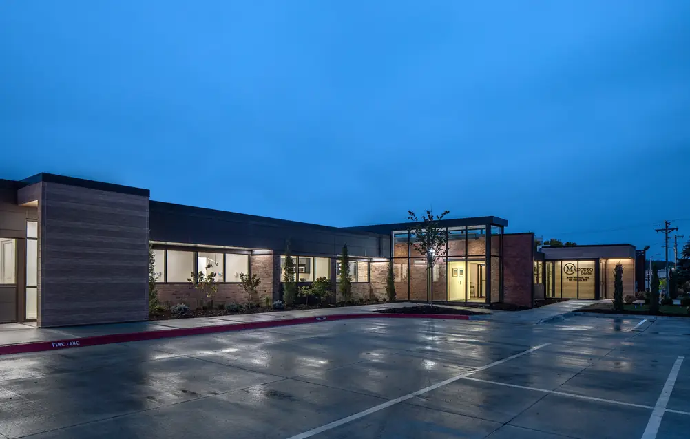 Mancuso Dental's building on Farnam Street in Omaha at dusk